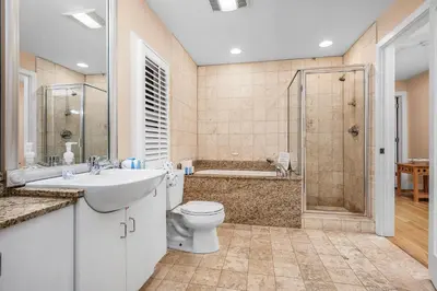 a bathroom with a toilet sink and a shower at Grand Tortuga Squirt in Panama City Beach