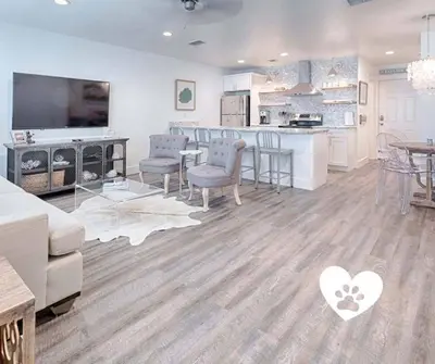 a living room with a kitchen and a dining room at Suite Y'all in Santa Rosa Beach