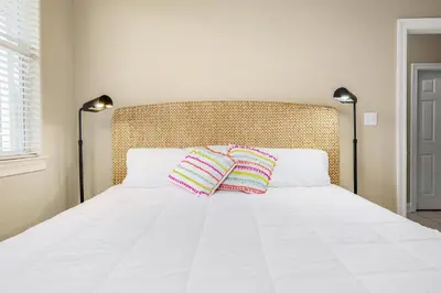a bedroom with a bed with two pillows on it at Ten Grand in Santa Rosa Beach