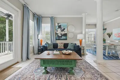a living room with a couch and a table at Ten Grand in Santa Rosa Beach
