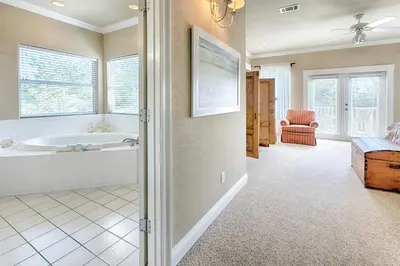 a bathroom with a bath tub and a claw foot tub at Ten Grand in Santa Rosa Beach