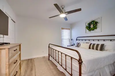 a bedroom with a bed and a ceiling fan at Wonderful World in Inlet Beach