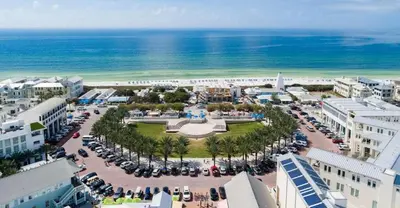 an aerial view of a parking lot near the ocean at Rollin Tides in Santa Rosa Beach