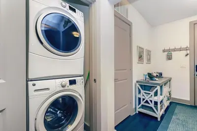 a washer and dryer in a laundry room at Shore Beats Workin' in Inlet Beach