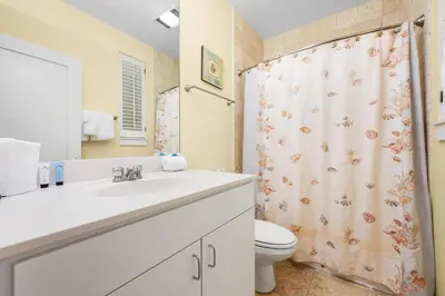 a bathroom with a sink and a toilet at Grand Tortuga Crush in Panama City Beach