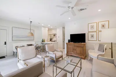 a living room with a couch and a tv at Summer Breeze by 30A Escapes in Rosemary Beach