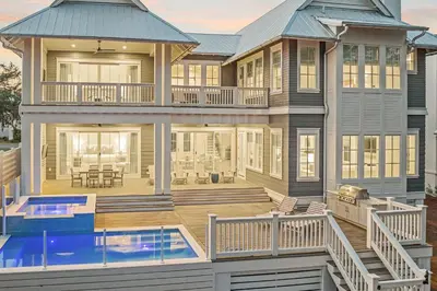 a house with a large deck and a swimming pool at Paralia 30A in Seagrove Beach