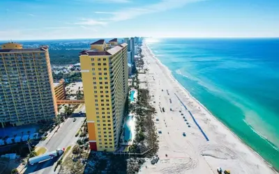 an aerial view of a beach and the ocean at Calypso 1607E in Panama City Beach