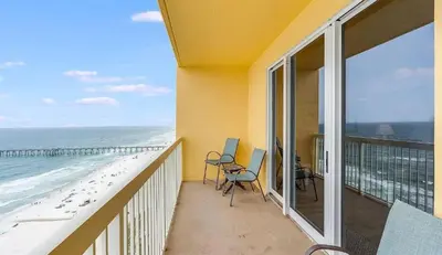 a balcony with a view of the beach at Calypso 1607E in Panama City Beach