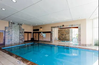 a large swimming pool in a hotel room at Aqua 408 in Panama City Beach