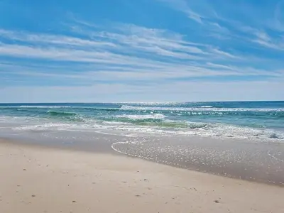 a sandy beach with the ocean in the background at Calypso 2107W in Panama City Beach