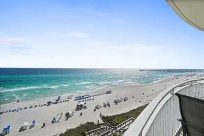 a view of a beach with umbrellas and the ocean at Aqua 603 in Panama City Beach