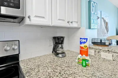 a kitchen counter with a blender on a counter top at Calypso 803W in Panama City Beach