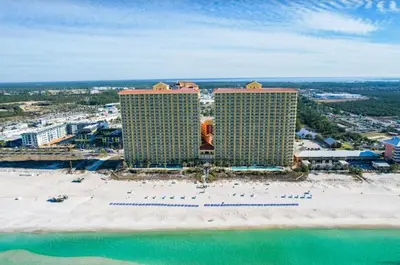 an aerial view of a resort with a beach and buildings at Calypso 803W in Panama City Beach
