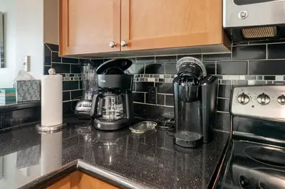 a kitchen counter top with appliances on it at 609 Aqua in Panama City Beach