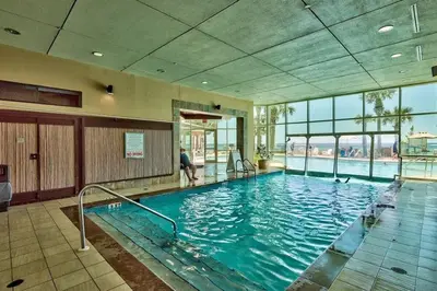 a large swimming pool in a building at Aqua 705 in Panama City Beach