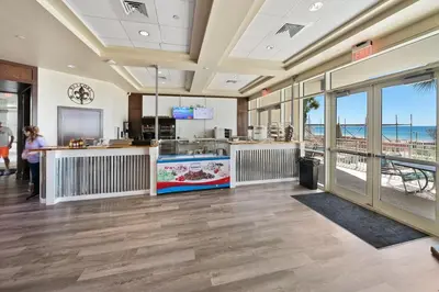 a restaurant with a view of the beach at Aqua 901 in Panama City Beach