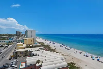 a view of a beach with buildings and the ocean at Aqua 901 in Panama City Beach
