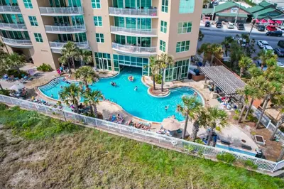 an aerial view of a pool at a resort at Aqua 1003 in Panama City Beach