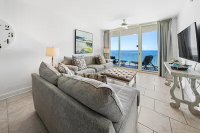 a living room with a couch and a table at 1403 Aqua in Panama City Beach