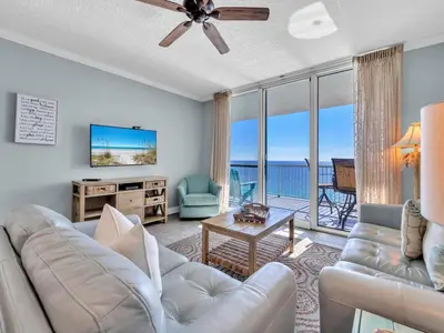 a living room with a couch and a ceiling fan at Palazzo 1406 by Emerald Coast Retreats in Panama City Beach