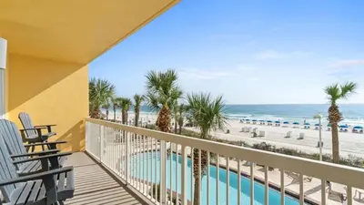 a balcony with chairs and a view of the beach at 204 West Calypso 2nd floor Gulf Front Specials! in Panama City Beach