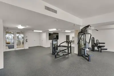 a gym with treadmills and ellipticals in a room at 204 West Calypso 2nd floor Gulf Front Specials! in Panama City Beach