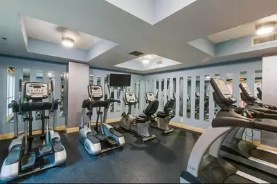 a gym with several cardio machines in a room at 204 West Calypso 2nd floor Gulf Front Specials! in Panama City Beach