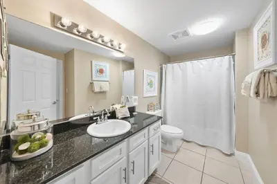a bathroom with a sink and a toilet at Calypso 208 East Direct Gulf Front Exceptional in Panama City Beach