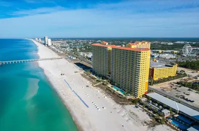 an aerial view of a beach with buildings and the ocean at Calypso 208 East Direct Gulf Front Exceptional in Panama City Beach