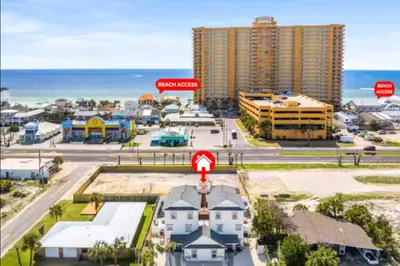 an aerial view of a city with buildings and the ocean at Spring Break! Heated Pool, Walk 2 Beach, Sleeps 11 in Panama City Beach