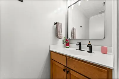 a bathroom with a sink and a mirror at Spring Break! Heated Pool, Walk 2 Beach, Sleeps 11 in Panama City Beach