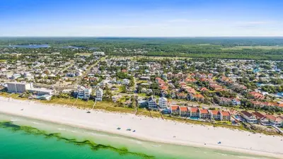 an aerial view of a resort on the beach at Palm Paradise in Panama City Beach
