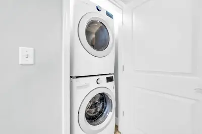 a washing machine and a washer and dryer in a room at Sterling Breeze 205 in Panama City Beach