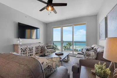 a living room with a view of the ocean at Calypso 302 West Direct Beach Front Awesome! in Panama City Beach