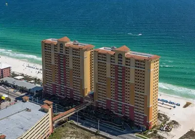 an aerial view of a hotel on the beach at 408E Calypso Elegant beach front Beach Svc Included in Panama City Beach