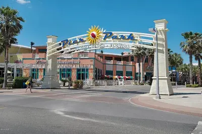 a large building with a large sign on a street at Calypso 909 West Tower GULF FRONT 3BR 3BA Views Forever in Panama City Beach