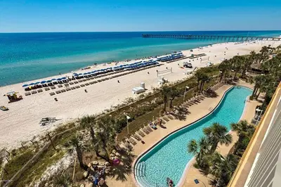 an aerial view of a beach with a swimming pool at Calypso 909 West Tower GULF FRONT 3BR 3BA Views Forever in Panama City Beach