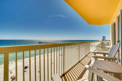 a balcony with two chairs and a view of the ocean at Calypso 909 West Tower GULF FRONT 3BR 3BA Views Forever in Panama City Beach