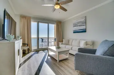 a living room with a couch and a ceiling fan at 1104 West 3 Bedrooms including 2 King Bedrooms and Custom Room in Panama City Beach