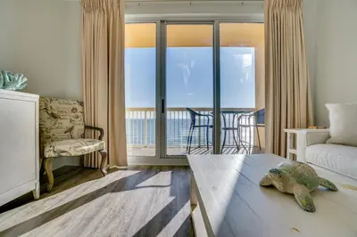 a living room with a view of the ocean at 1104 West 3 Bedrooms including 2 King Bedrooms and Custom Room in Panama City Beach