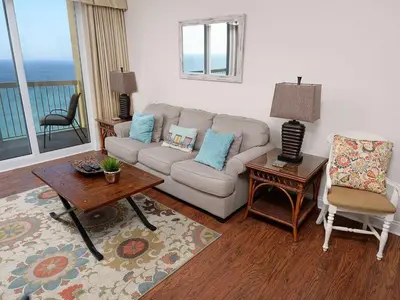 a living room with a couch and a table at 1202 East Calypso Gulf Front 3Bedroom 2 Bath in Panama City Beach