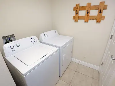 a white washer and dryer in a laundry room at 1202 East Calypso Gulf Front 3Bedroom 2 Bath in Panama City Beach