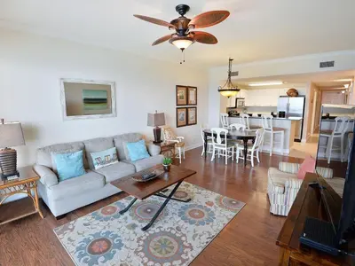 a living room with a couch and a table at 1202 East Calypso Gulf Front 3Bedroom 2 Bath in Panama City Beach