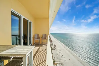 a view of the ocean from the balcony of a house at Calypso 2306E Penthouse Condo 3BR 2BA Best Views Anywhere in Panama City Beach