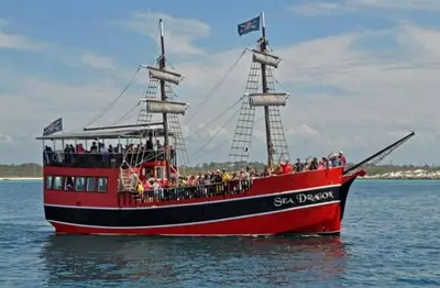 a group of people on a pirate ship in the water at Calypso 1206 West Direct Gulf Front Custom Walk In Shower in Panama City Beach