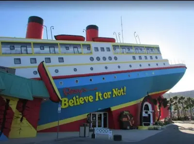 a large cruise ship parked next to a building at Calypso 1206 West Direct Gulf Front Custom Walk In Shower in Panama City Beach