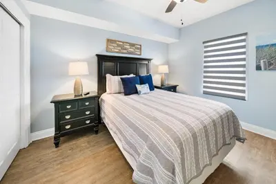 a bedroom with a large bed and a window at 2206E Calypso Direct Gulffront Brand new remodel in Panama City Beach