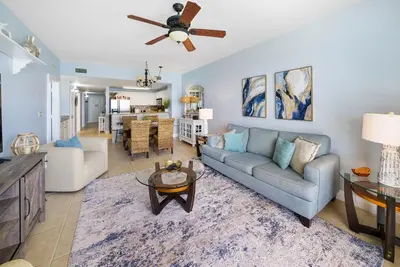 a living room with a couch and a ceiling fan at 2206E Calypso Direct Gulffront Brand new remodel in Panama City Beach
