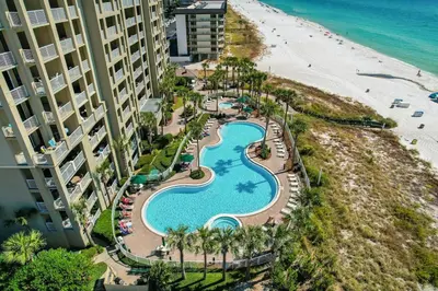 an aerial view of a resort swimming pool and the beach at Grand Panana 106 in Panama City Beach